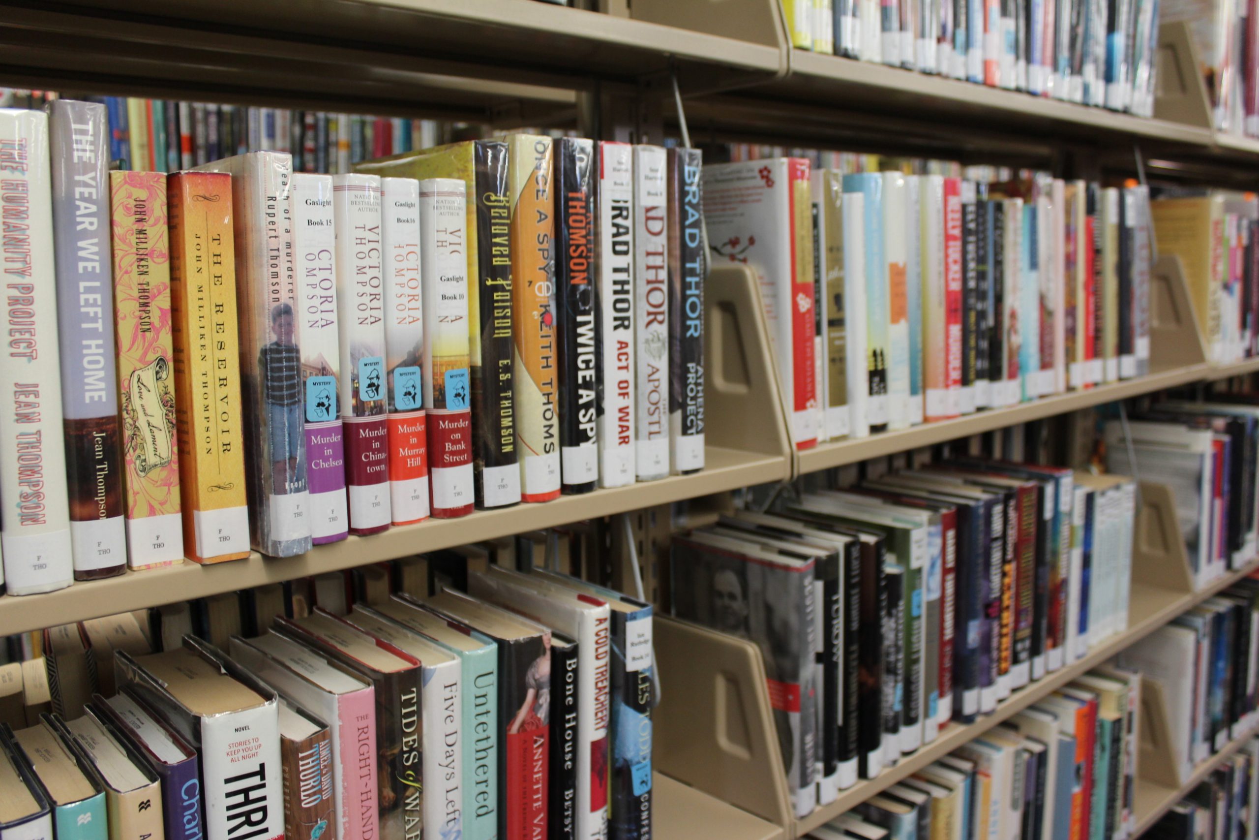 Rack of adult books at Reddick Library.